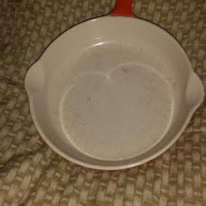 Cast iron coated orange 6 1/2 " diameter